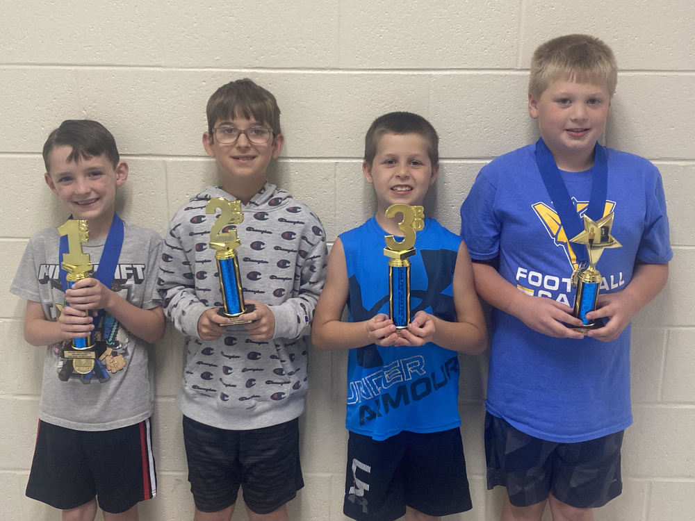 four 2nd grade boys who won a checkers game