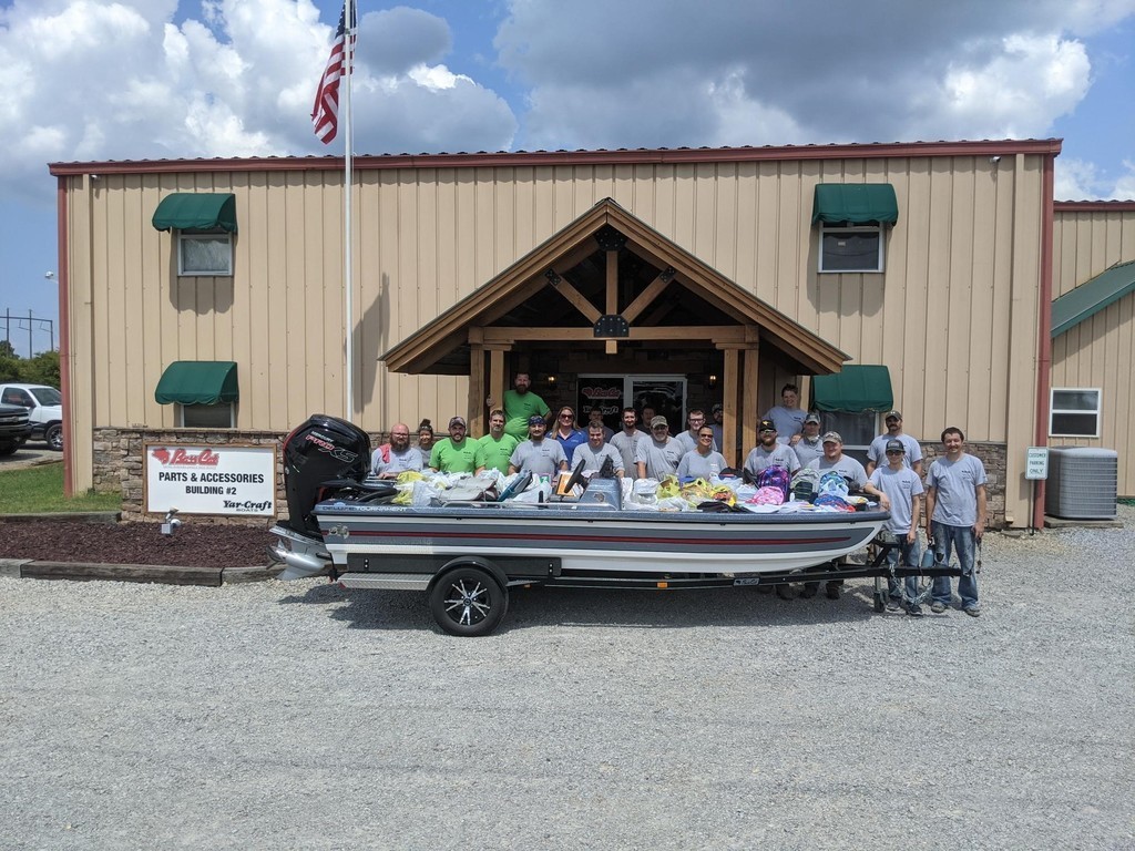 men standing with a boat