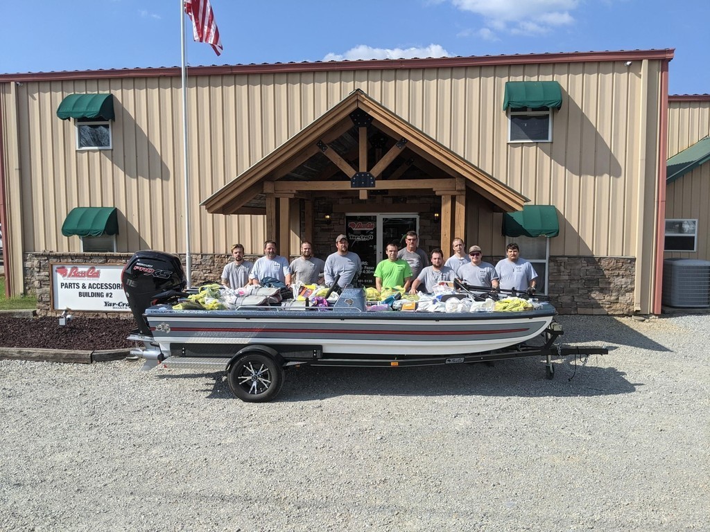 Men standing with a boat