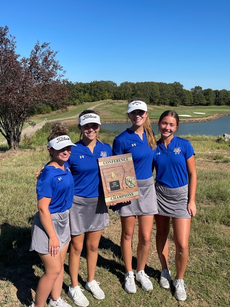 girl golfers with a trophy 