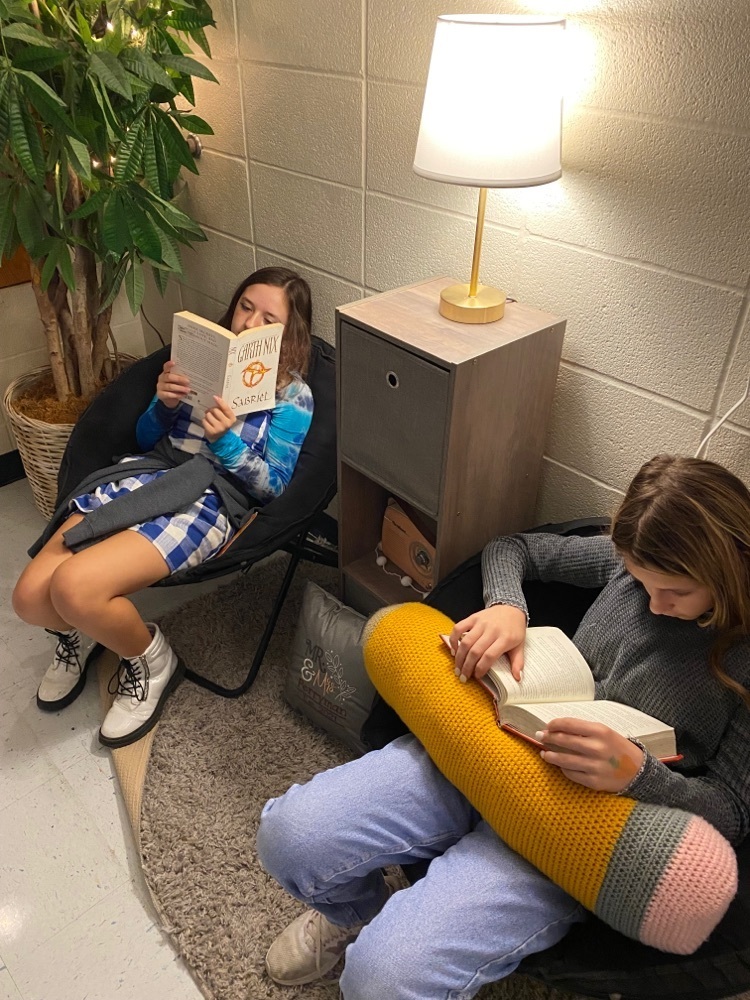 two girls reading in class