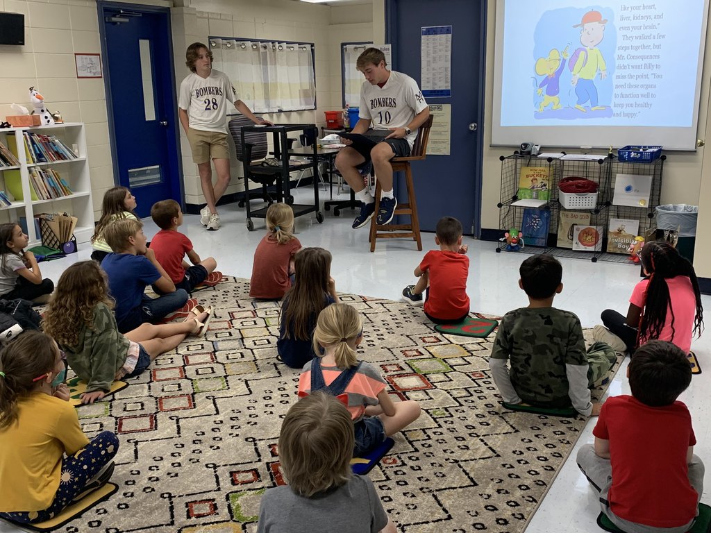 High School students reading to 1st graders