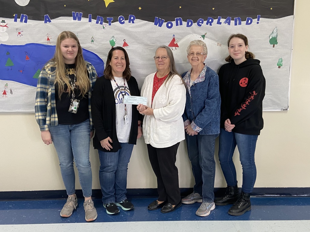 student council members presenting a check to food bank