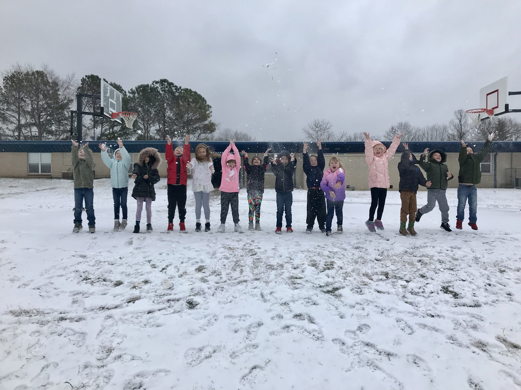 Kindergarten students throwing snow in a line!