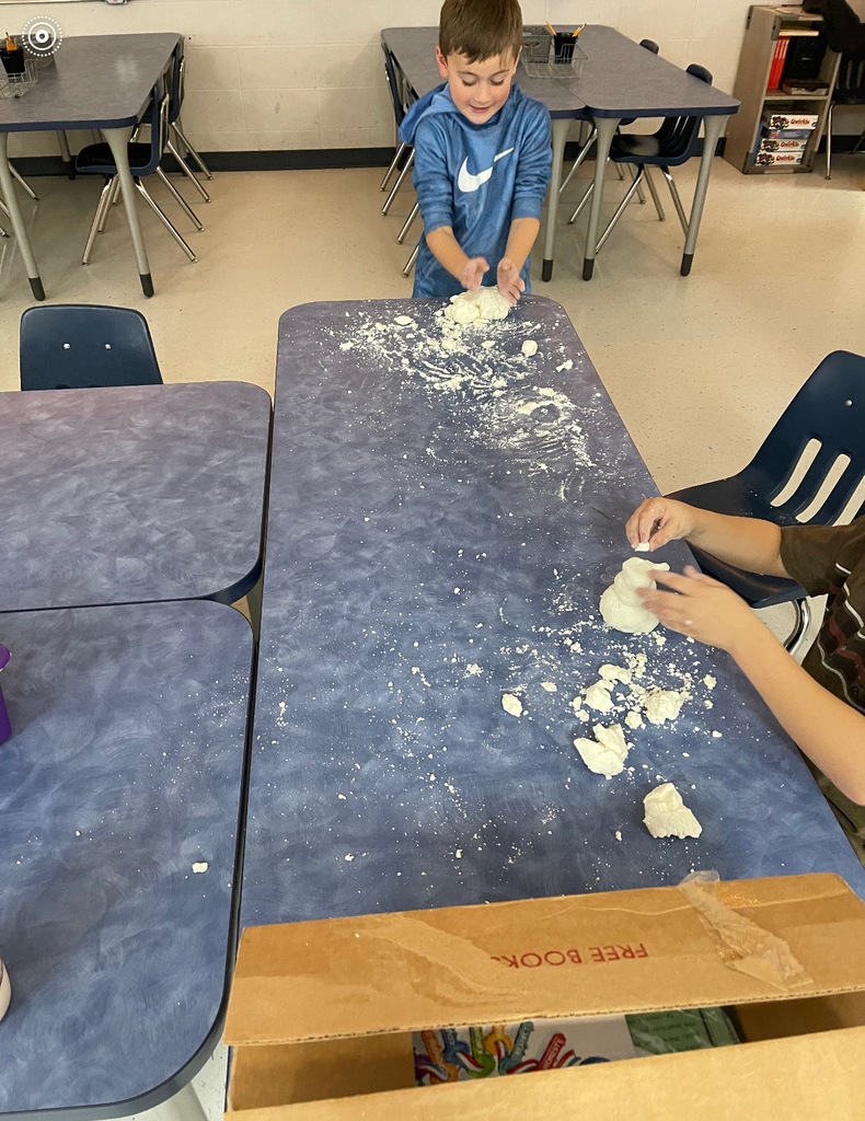 kids building snowmen with dough