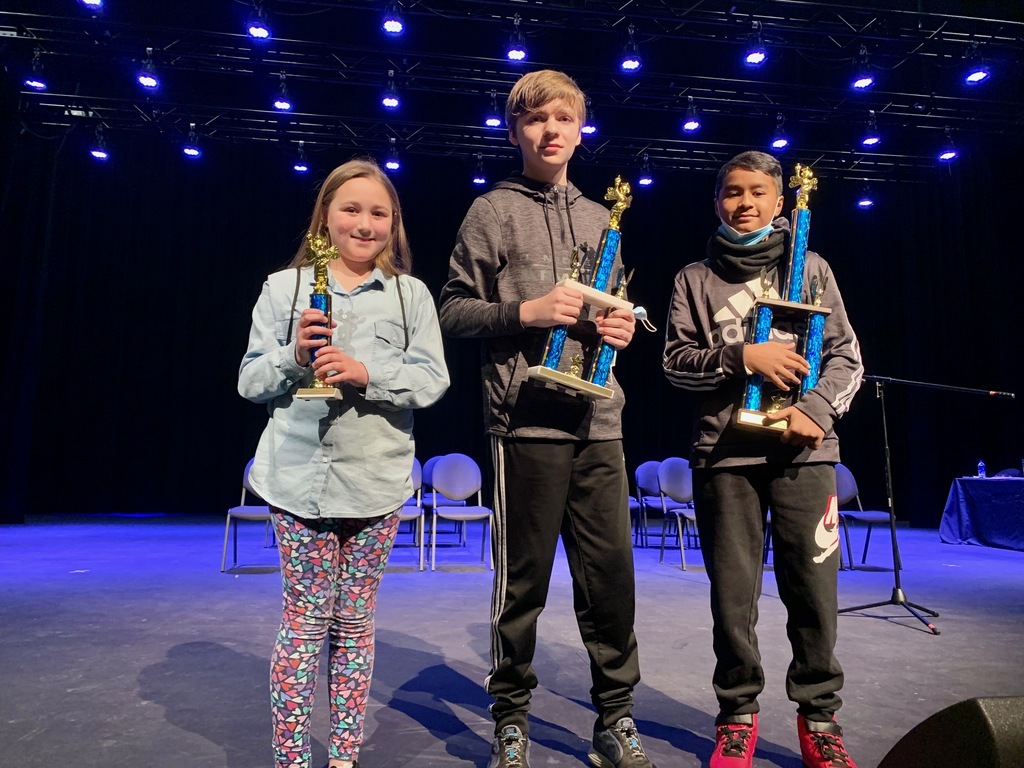 three kids holding trophies