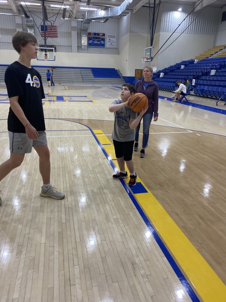 a boy shooting a basketball