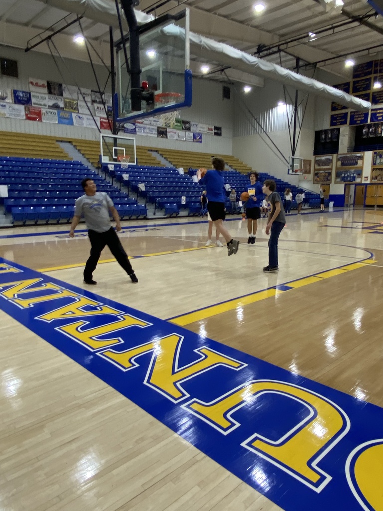 a boy shooting a basketball