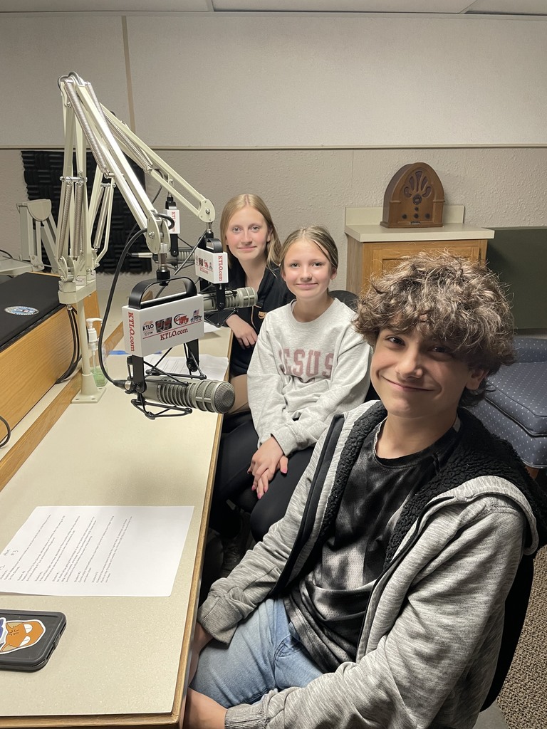 twi girls and a boy at a radio station