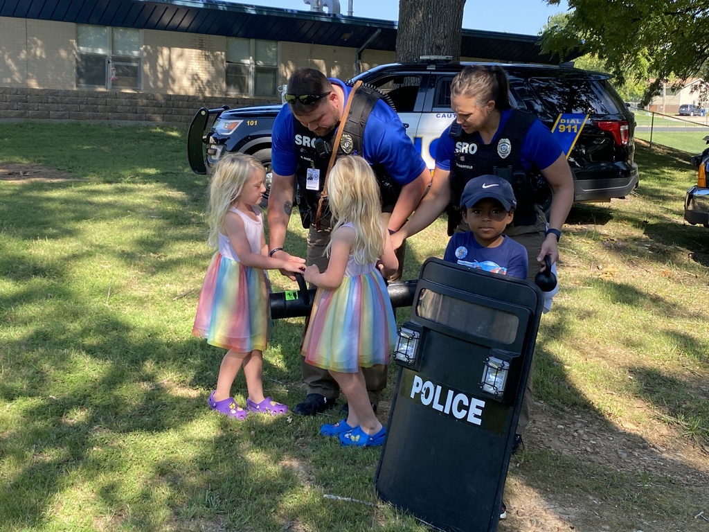 SROs with kinders and a shield
