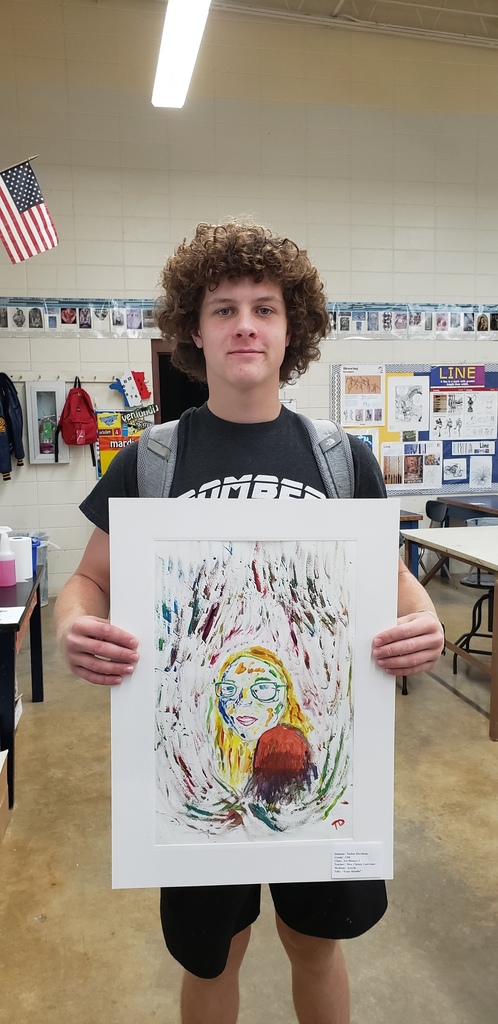 a high school boy with his art project