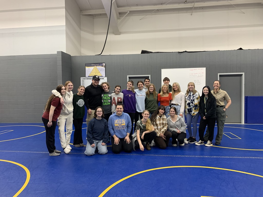 high school students posing together after self defense class