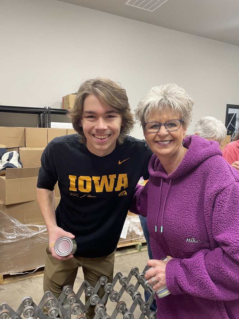a boy volunteering at the food bank