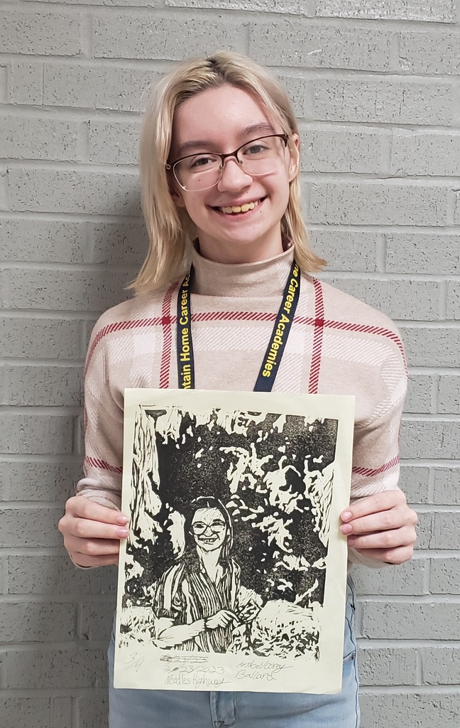 girl holding artwork