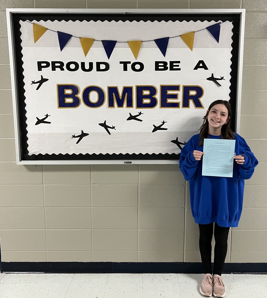 a girl holding an award letter